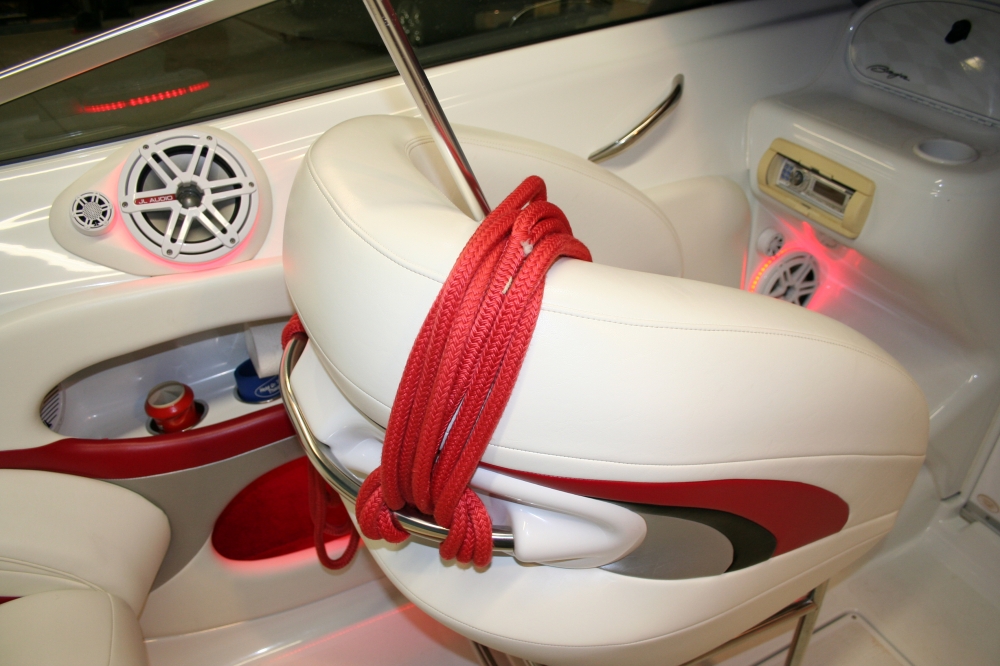 Interior of a red and white boat with a custom audio system