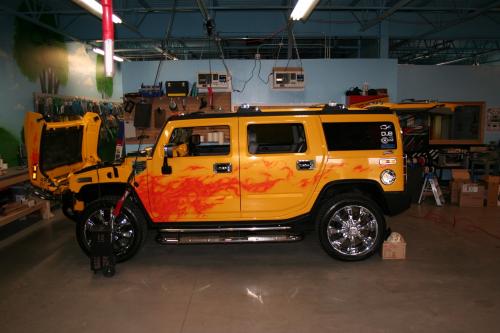 Yellow Hummer with flame decal