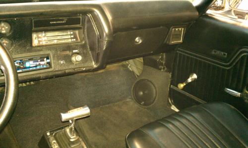 Interior of a vintage car with a modern radio