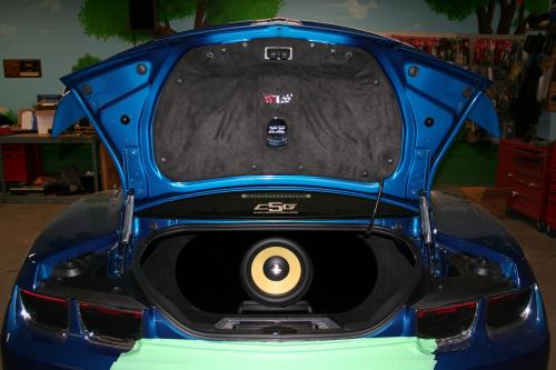 Trunk of a blue Corvette with Focal speaker inside
