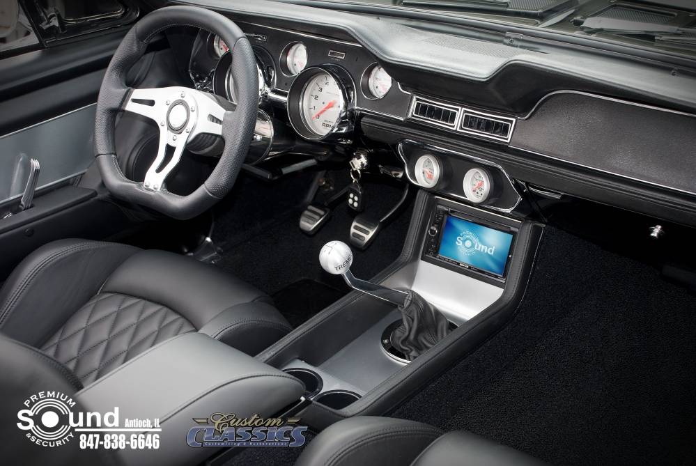 Interior of a classic car with a in-dash video player